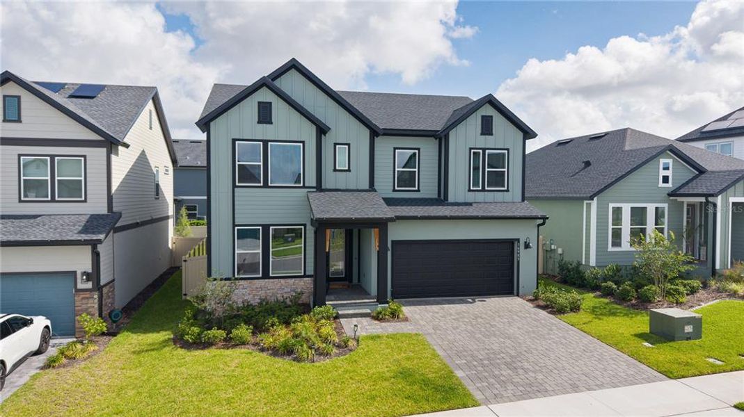 Front exterior of a new home in , Clermont, FL, highlighting curb appeal (Image 24).