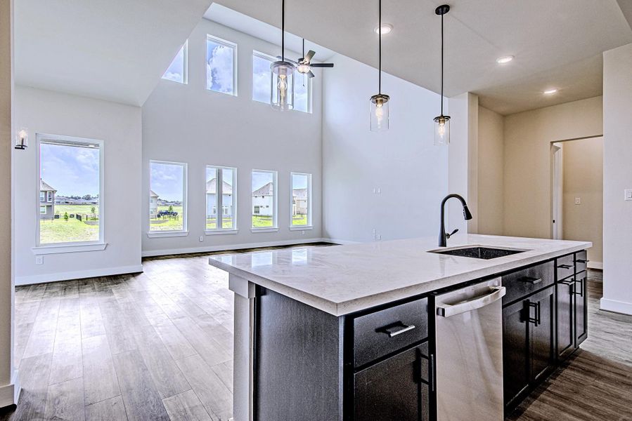 Spacious kitchen overlooking the main living and dining areas Spacious kitchen overlooking the main living and dining areas