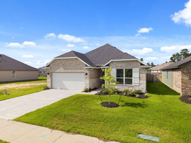 Front exterior of a new home in Grand Oaks Reserve, Cleveland, TX, highlighting curb appeal (Image 2). Front exterior of a new home in Grand Oaks Reserve, Cleveland, TX, highlighting curb appeal (Image 2).