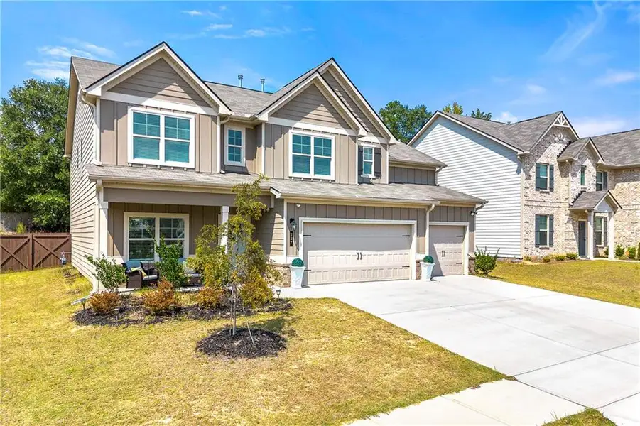 Front exterior of a new home in , Loganville, GA, highlighting curb appeal (Image 20).