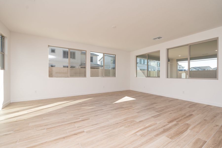 Spacious, unfurnished interior of a new home in Waterston Central, Gilbert (Image 9).