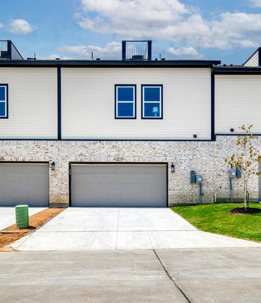 Front exterior of a new home in , Rowlett, TX, highlighting curb appeal (Image 2). Front exterior of a new home in , Rowlett, TX, highlighting curb appeal (Image 2).
