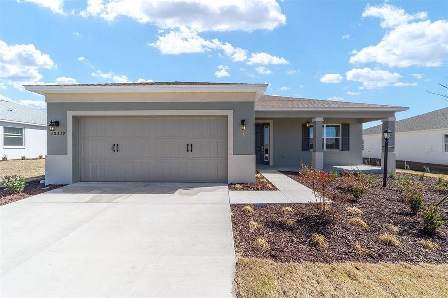 Front exterior of a new home in , Ocala, FL, highlighting curb appeal (Image 20).