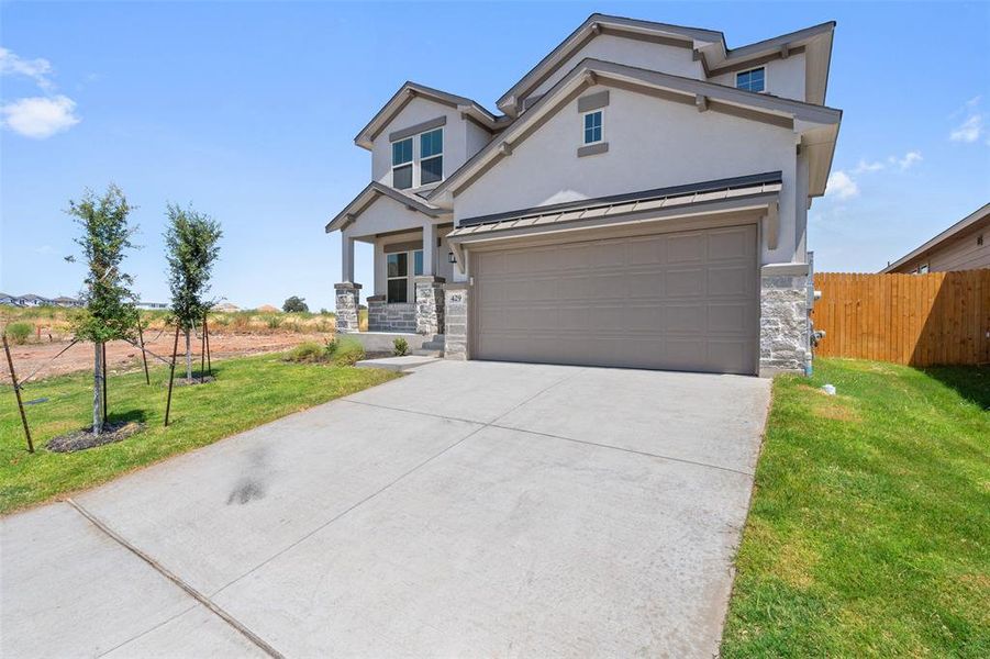 Front exterior of a new home in Lakeside at Tessera on Lake Travis, Meadowlakes, TX, highlighting curb appeal (Image 3). Front exterior of a new home in Lakeside at Tessera on Lake Travis, Meadowlakes, TX, highlighting curb appeal (Image 3).