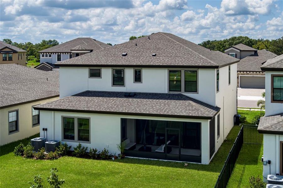 Exterior details and patio area of a home in Crosswind Point, Parrish (Image 28).