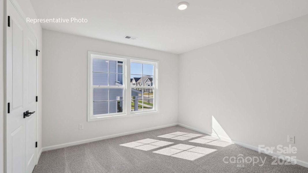 Spacious, unfurnished interior of a new home in Sanctuary at Southgate, Indian Trail (Image 25).