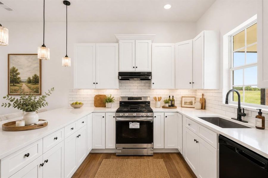 U-shaped kitchen featuring white shaker cabinetry, white subway tile backsplash, stainless steel gas range, and a black single-basin sink with a matte black faucet
