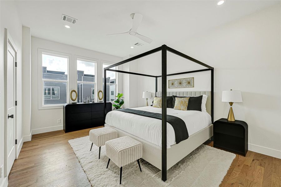 3rd floor features the primary suite with a spa-style walk-in shower, oversized soaking tub, and large walk-in closet, plus an additional bedroom.