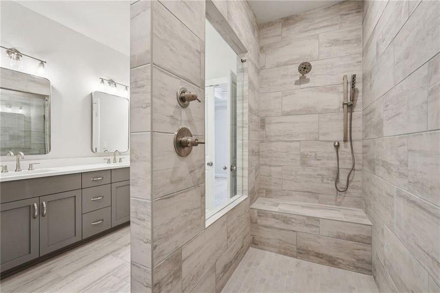 Bathroom with double vanity and walk in shower