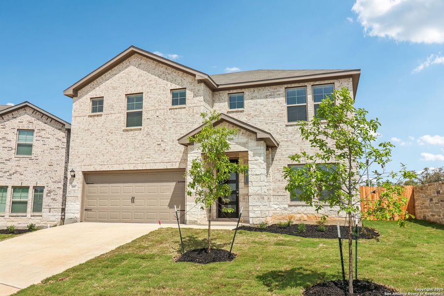 Front exterior of a new home in Autry Pond, San Antonio, TX, highlighting curb appeal (Image 2). Front exterior of a new home in Autry Pond, San Antonio, TX, highlighting curb appeal (Image 2).