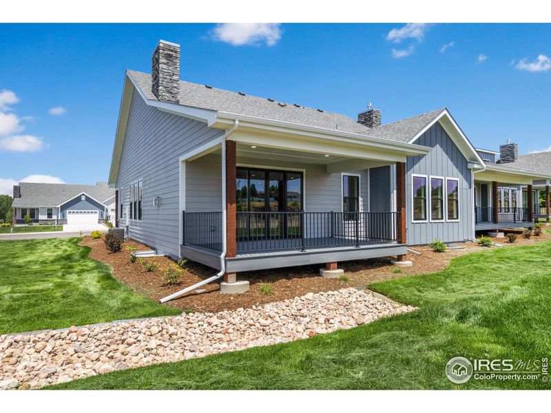 The expansive Trex back covered porch, accessed from the living room