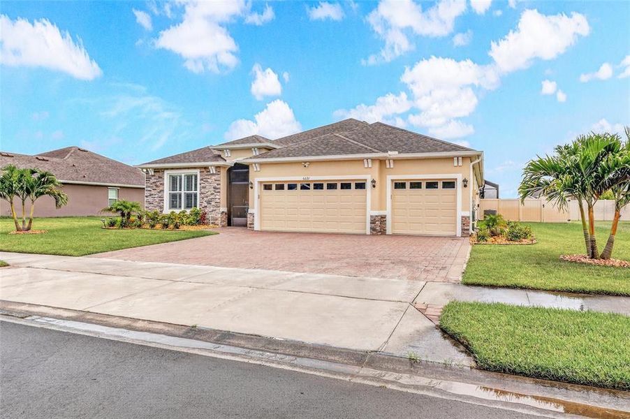 Front exterior of a new home in Crystal Bay Estates, Grant-Valkaria, FL, highlighting curb appeal (Image 22). Front exterior of a new home in Crystal Bay Estates, Grant-Valkaria, FL, highlighting curb appeal (Image 22).