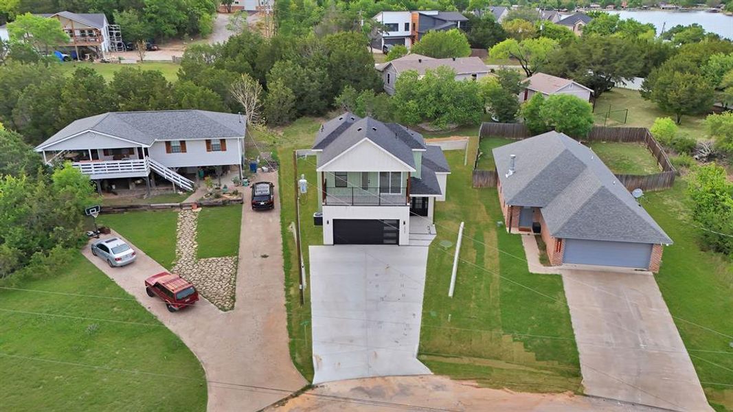 Front exterior of a new home in , Granbury, TX, highlighting curb appeal (Image 23).