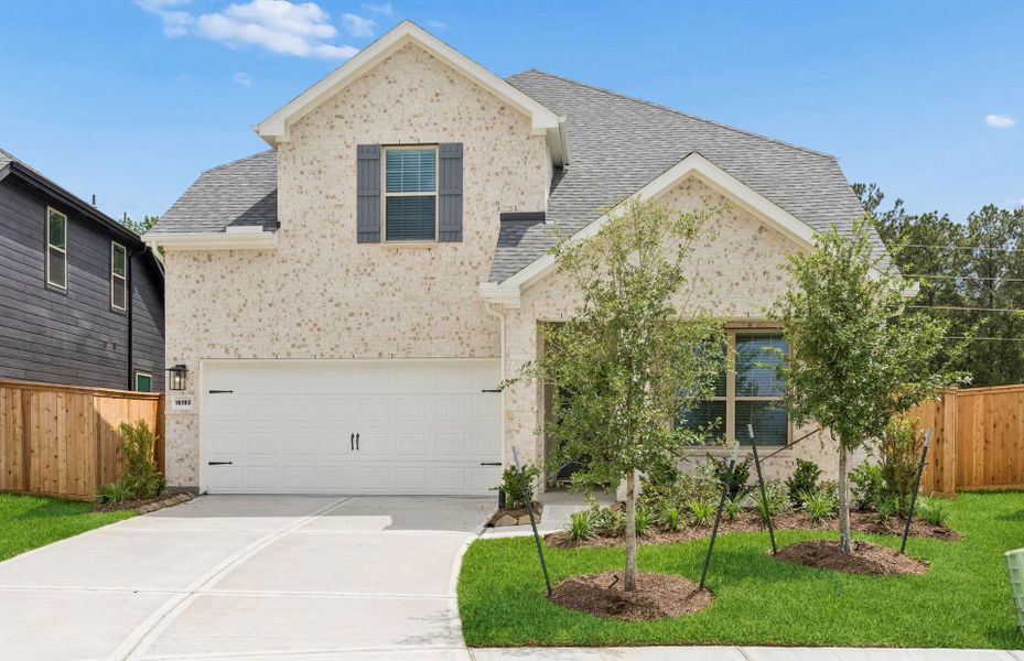 Front exterior of a new home in Mavera, Conroe, TX, highlighting curb appeal (Image 1). Front exterior of a new home in Mavera, Conroe, TX, highlighting curb appeal (Image 1).