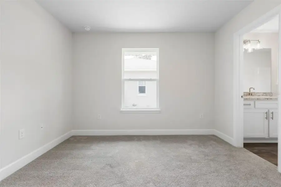 Representative unfurnished interior of a home built from the 2117 by Adams Homes in Flagler Estates, Hastings (Image 30).