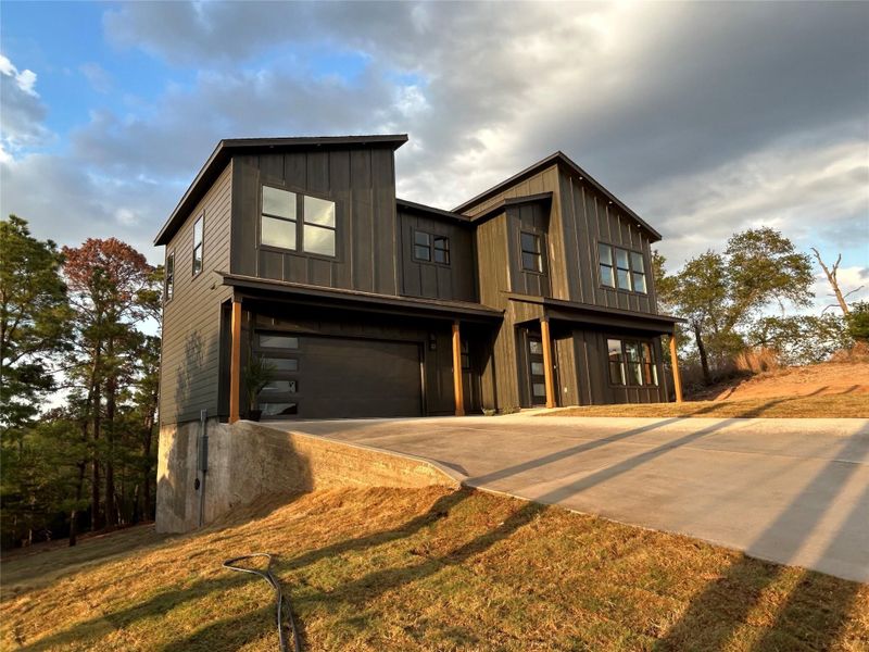 Front exterior of a new home in , Bastrop, TX, highlighting curb appeal (Image 21). Front exterior of a new home in , Bastrop, TX, highlighting curb appeal (Image 21).