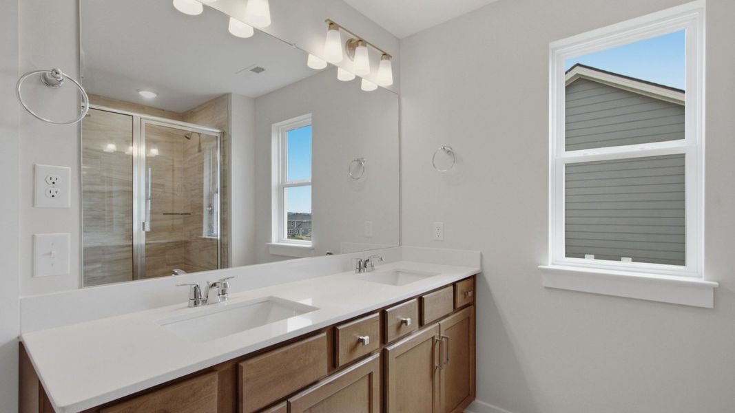 Primary bathroom with dual vanity sinks