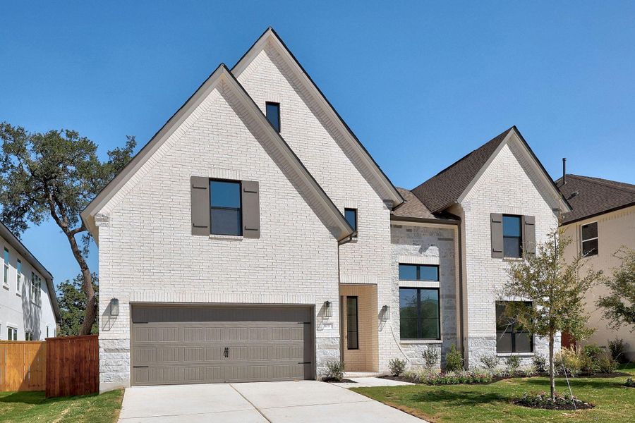 Front exterior of a new home in Parmer Ranch, Georgetown, TX, highlighting curb appeal (Image 22). Front exterior of a new home in Parmer Ranch, Georgetown, TX, highlighting curb appeal (Image 22).