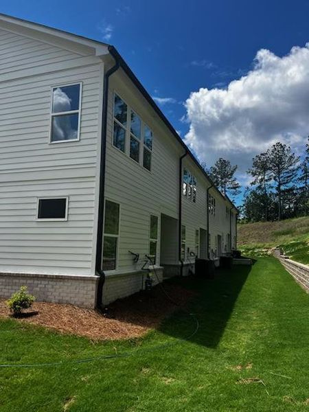 Front exterior of a new home in Riversong, Duluth, GA, highlighting curb appeal (Image 24).