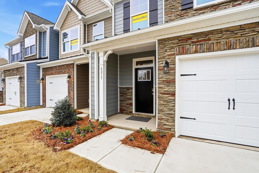 Exterior details and patio area of a home in Harrisburg Village Townhomes, Harrisburg (Image 3).