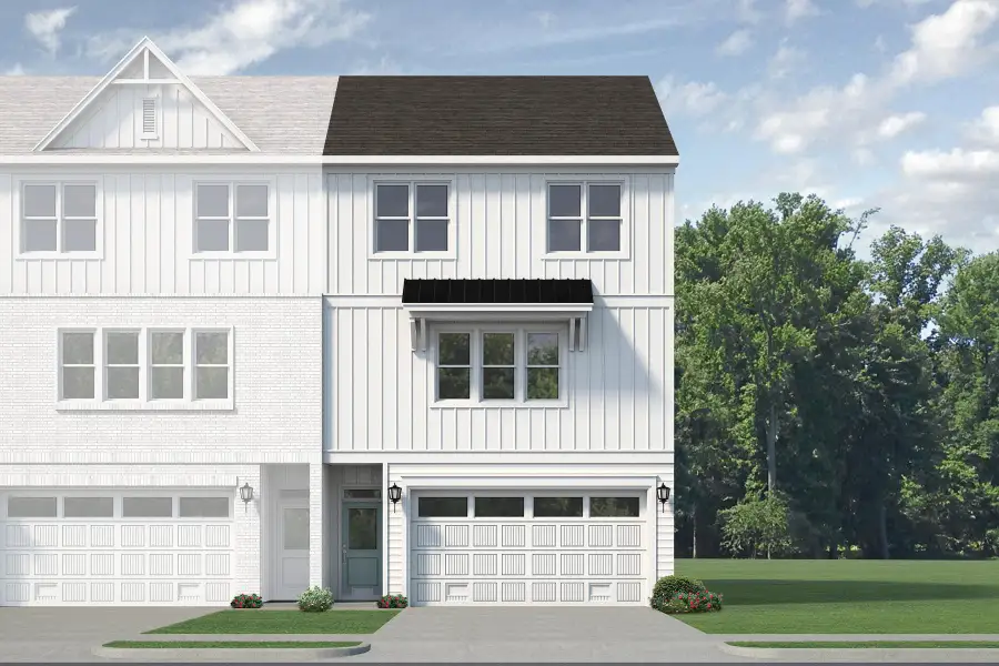Front exterior of a new home in Anchors Bend Townes, Wilmington, NC, highlighting curb appeal (Image 10). Front exterior of a new home in Anchors Bend Townes, Wilmington, NC, highlighting curb appeal (Image 10).