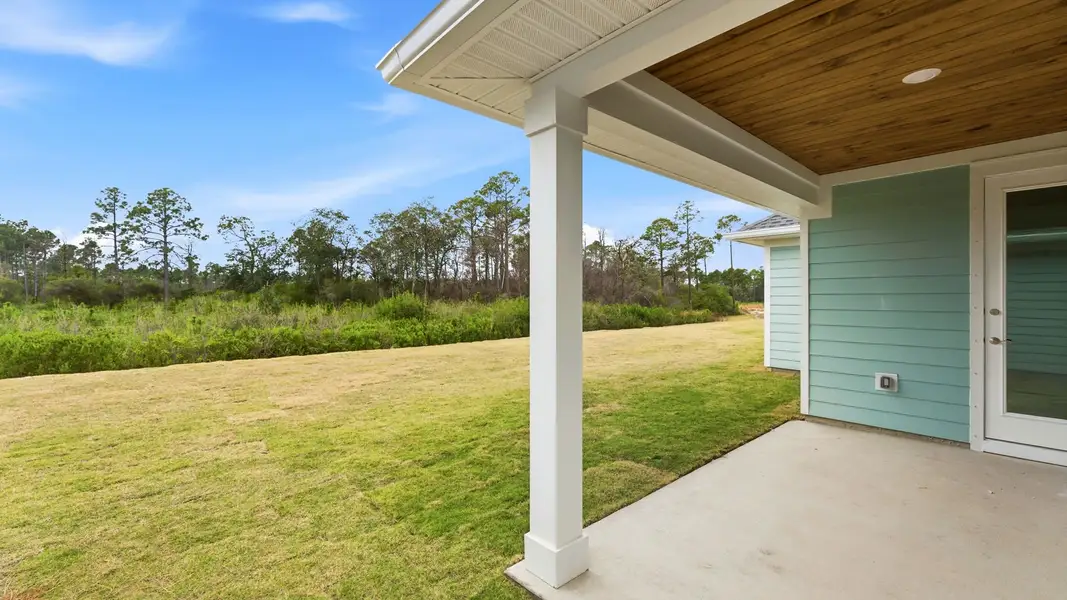 Exterior details and patio area of a home in Breakfast Point East Phase II, Panama City Beach (Image 4).