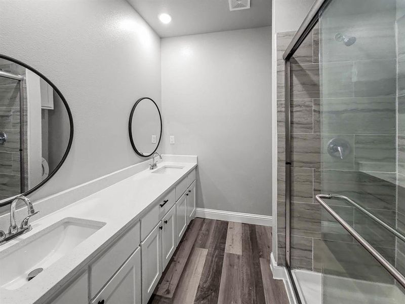 Primary bedroom featuring a tray ceiling, recessed lighting, ceiling fan, carpet flooring, and baseboards Primary bedroom featuring a tray ceiling, recessed lighting, ceiling fan, carpet flooring, and baseboards