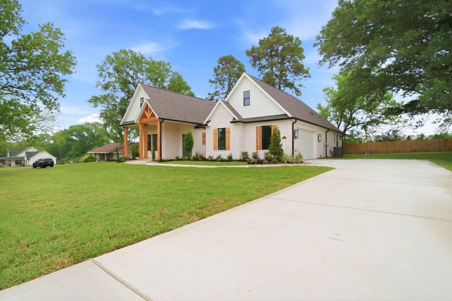 Front exterior of a new home in , Montgomery, TX, highlighting curb appeal (Image 26).