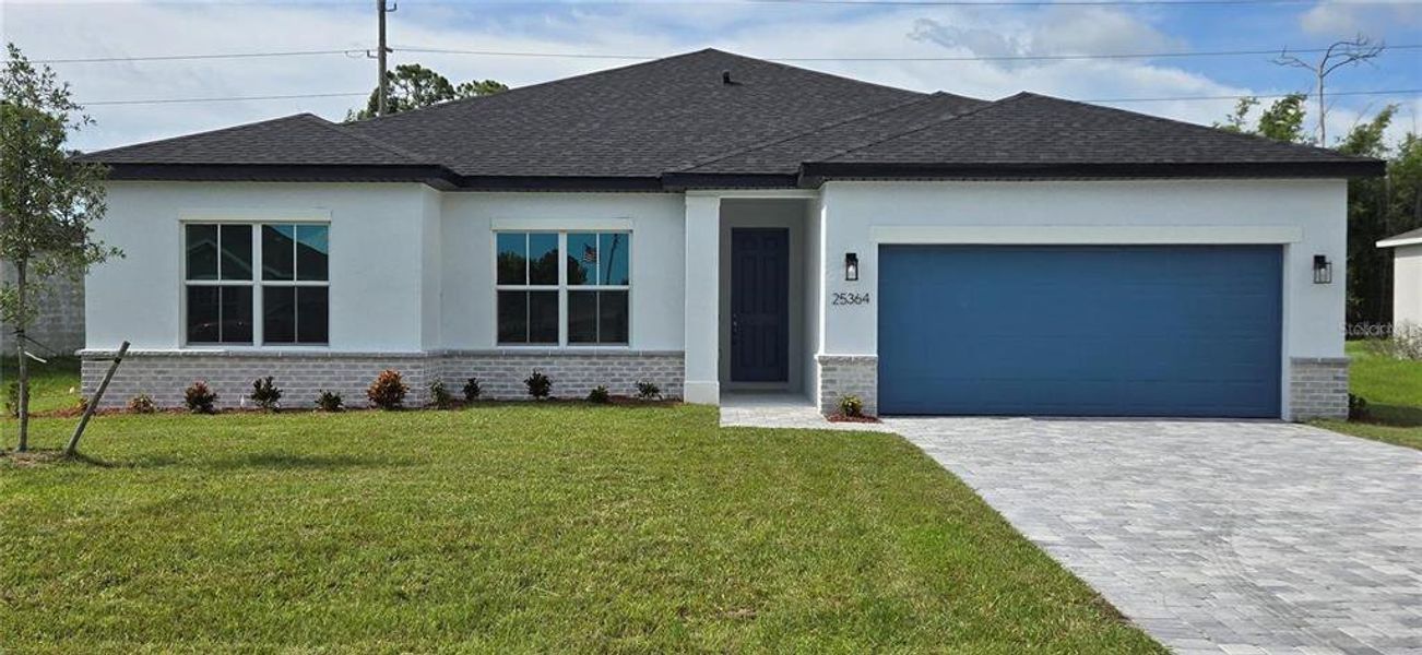 Front exterior of a new home in , Punta Gorda, FL, highlighting curb appeal (Image 1). Front exterior of a new home in , Punta Gorda, FL, highlighting curb appeal (Image 1).
