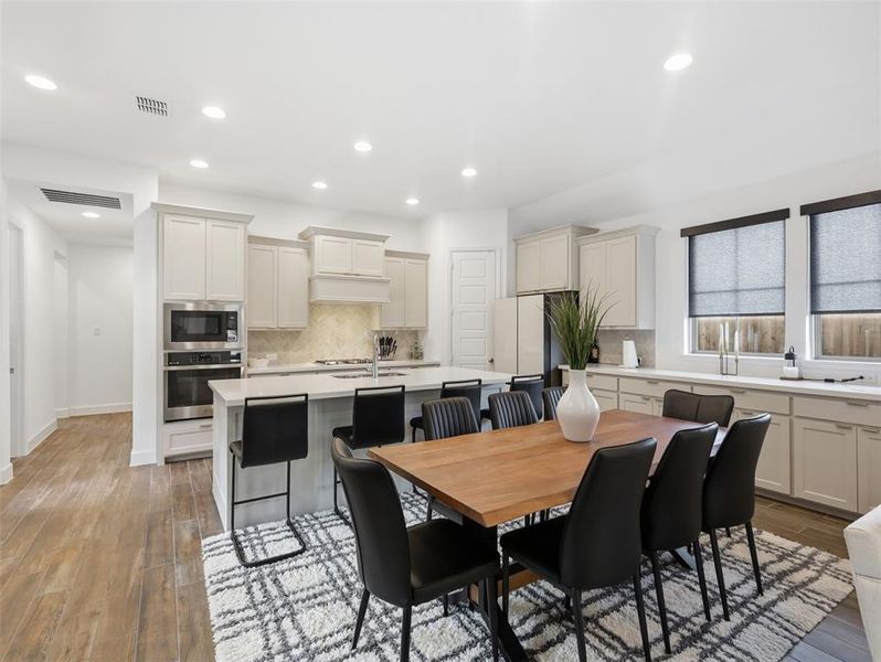 The open concept floor plan allows for a natural flow between living, dining and the kitchen area!