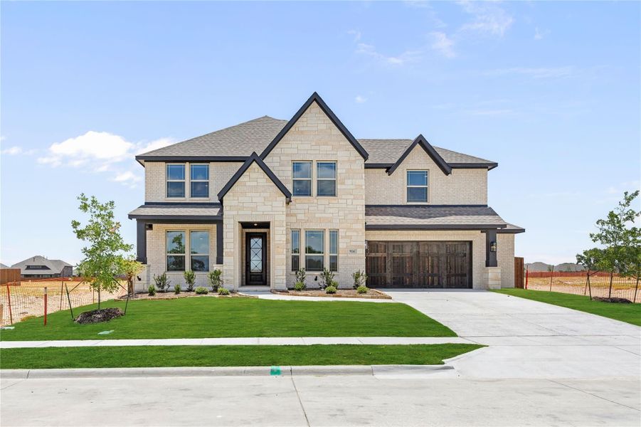 Two-story home with light stone exterior, two-car garage, and manicured front lawn Two-story home with light stone exterior, two-car garage, and manicured front lawn