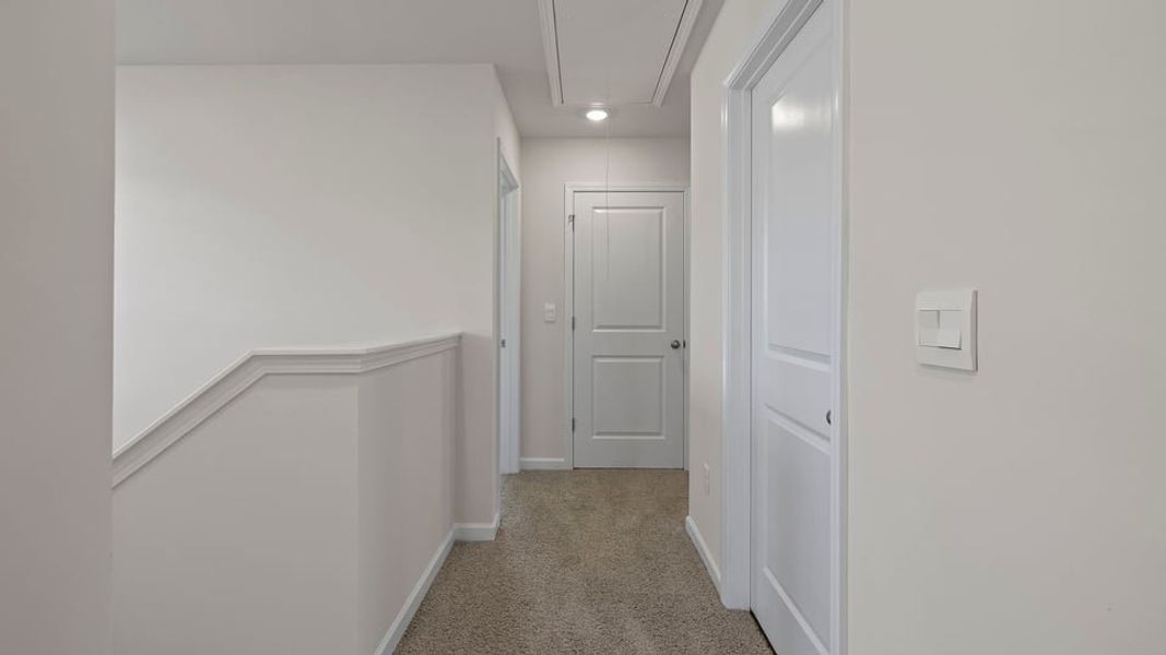 Spacious, unfurnished interior of a new home in Bentley Park, Greenwood (Image 24).