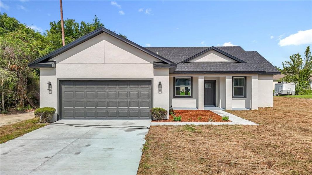 Front exterior of a new home in , Ocala, FL, highlighting curb appeal (Image 23).