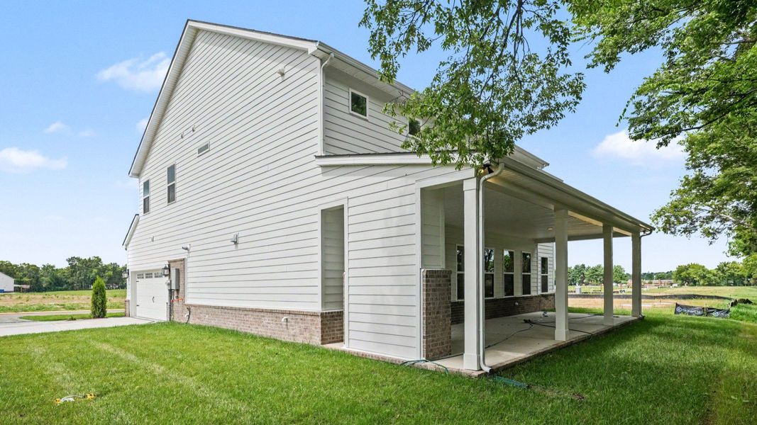 Front exterior with side view and side-load garage Front exterior with side view and side-load garage