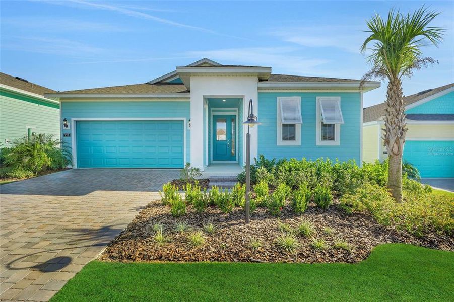 Front exterior of a new home in Green Key Village, Lady Lake, FL, highlighting curb appeal (Image 24).