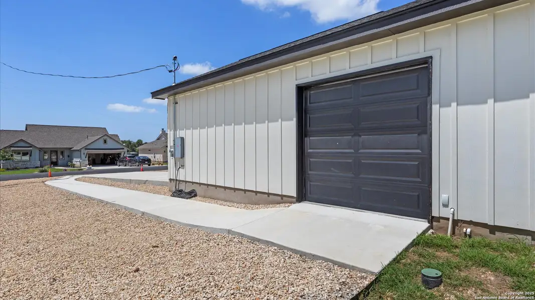 Front exterior of a new home in , Blanco, TX, highlighting curb appeal (Image 2).