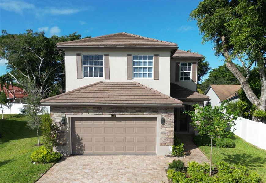Front exterior of a new home in , Tamarac, FL, highlighting curb appeal (Image 26).