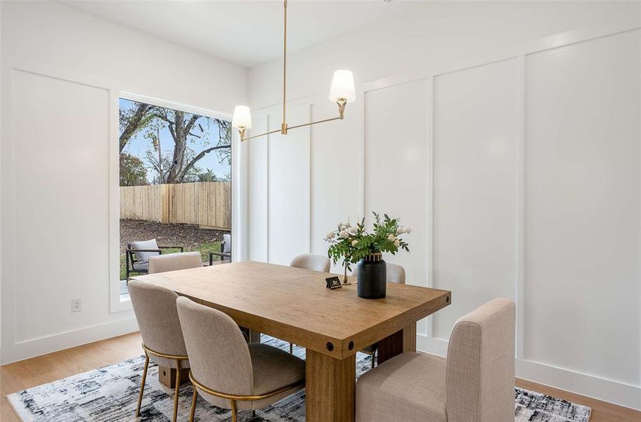 Dining area featuring light wood-type flooring and plenty of natural light