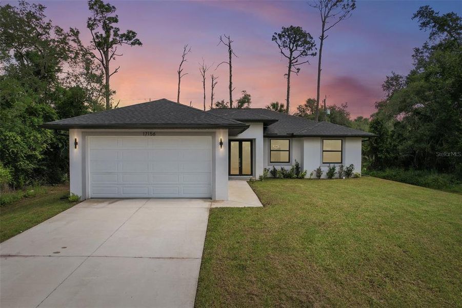 Front exterior of a new home in , Port Charlotte, FL, highlighting curb appeal (Image 27).