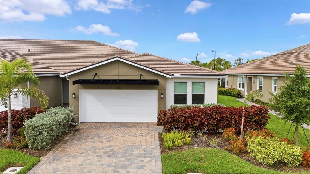 Front exterior of a new home in , Venice, FL, highlighting curb appeal (Image 2). Front exterior of a new home in , Venice, FL, highlighting curb appeal (Image 2).