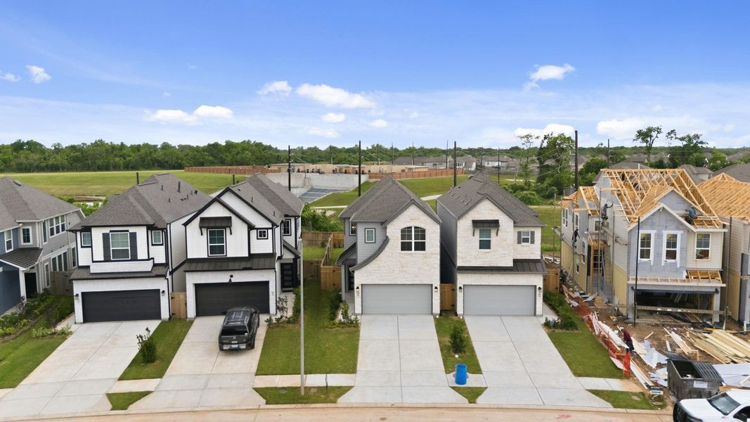 Front exterior of a new home in Sienna, Missouri City, TX, highlighting curb appeal (Image 22). Front exterior of a new home in Sienna, Missouri City, TX, highlighting curb appeal (Image 22).