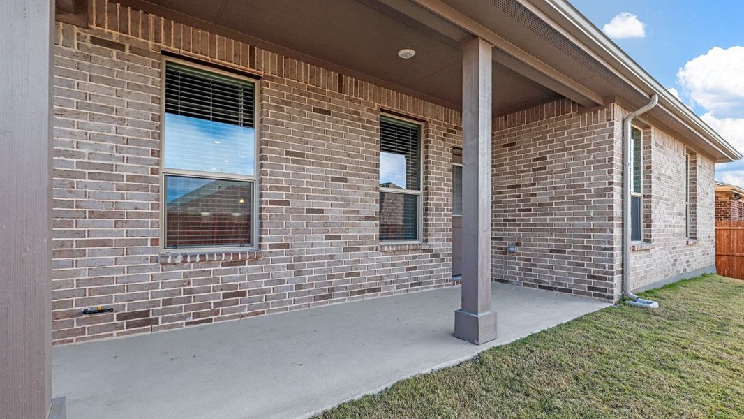 Exterior details and patio area of a home in Treeline, Justin (Image 3).