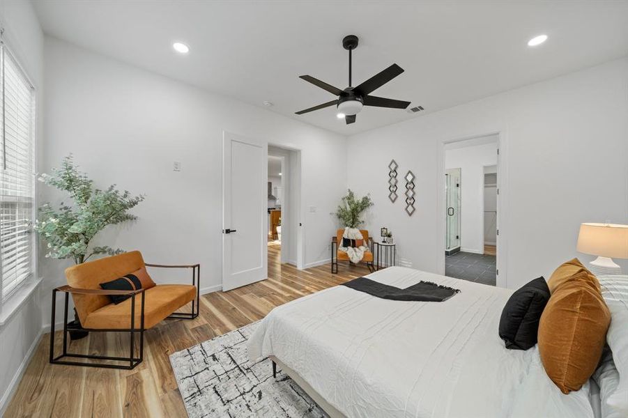 Bedroom featuring ceiling fan and light hardwood / wood-style floors