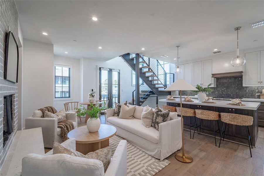 Living room featuring french doors and light hardwood flooring