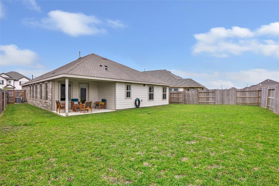 Exterior details and patio area of a home in Pinewood at Grand Texas, New Caney (Image 4).
