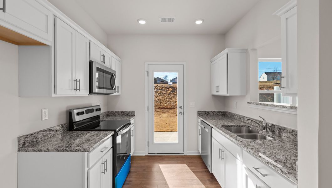 Furnished interior view inside a new home in Tanglewood Townes, Greenville (Image 8).