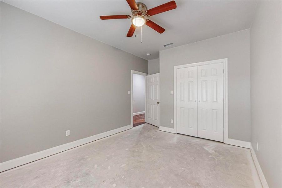 Unfurnished bedroom with a closet and ceiling fan