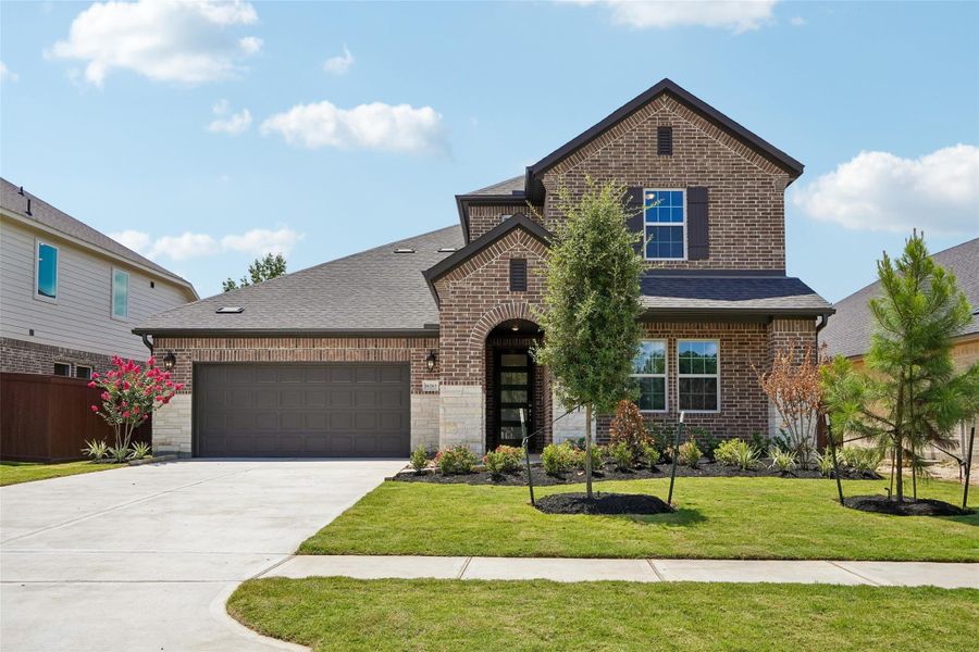 Front exterior of a new home in Evergreen 55', Conroe, TX, highlighting curb appeal (Image 1). Front exterior of a new home in Evergreen 55', Conroe, TX, highlighting curb appeal (Image 1).