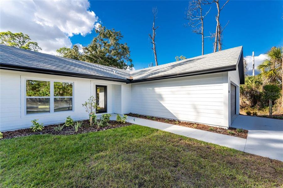 Exterior details and patio area of a home in , North Port (Image 27).
