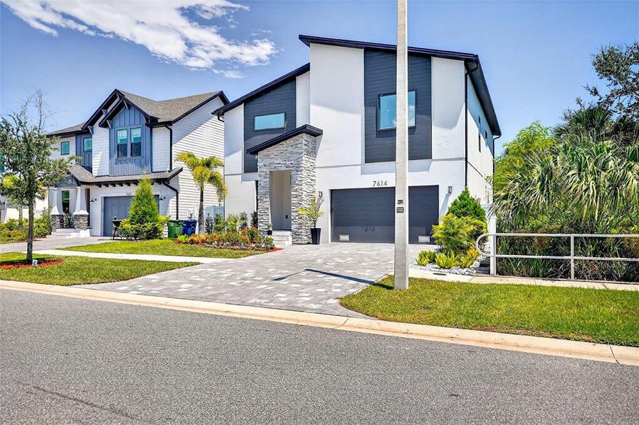 Front exterior of a new home in , Tampa, FL, highlighting curb appeal (Image 24).